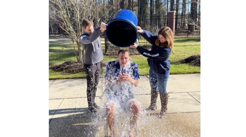 water being dumped on a man outside